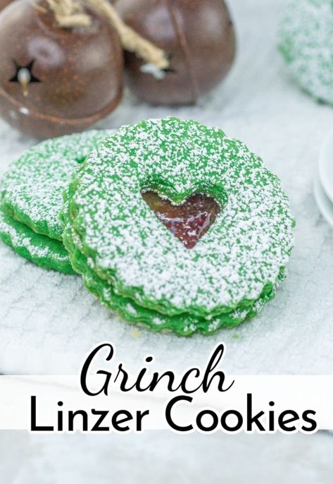 With a tasty blend of sweet raspberry jam and buttery almond goodness, these Grinch Cookies are sure to melt even the coldest of hearts. Grinch Thumbprint Cookies, Grinch Cookies, Cookie Recipes From Scratch, Welcome To Christmas, Holiday Baking Recipes, Linzer Cookies, Cookie Recipes Unique, Healthy Cookie Recipes, Easy Cookie Recipes