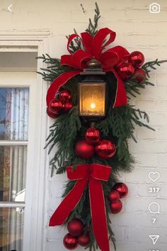 Red Front Door Christmas Decorations, Red Christmas Porch Decor, Red And White Christmas Swag, Outdoor Xmas Decorations Front Yards, Lantern Wreath, Lantern Swag, Outside Christmas Decorations, Christmas Floral Arrangements, Christmas Themes Decorations