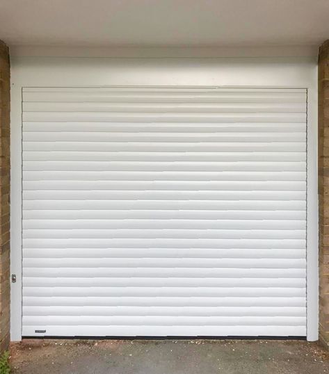 A Seceuroglide Classic Roller Garage Door in White, fitted between the opening with a manual override in the event of a power failure. It was installed in Epsom by our New Malden Branch.  If you're pressed for space within your garage, we recommend a SeceuroGlide Roller Garage Door. They can be fitted either between, behind or in front of the opening & come with the 'Secured By Design' certification for your peace of mind.  Call us on 0800 716 569 or visit www.accessgaragedoors.com Roll Up Garage Door, Glass Kitchen Cabinet Doors, Security Shutters, Shutter Designs, Rolling Shutter, Metal Doors, Roll Up Doors, Power Failure, Metal Door