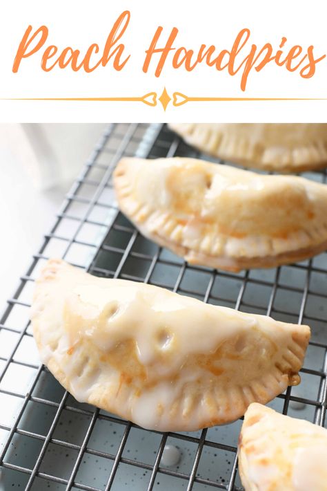 Deliciously glazed, these Peach Hand Pies desserts are so sweet and easy to make. Homemade peach pie filling is nestled in-between flaky pie crust and sealed up perfectly. These are easy to eat and fun to make with minimal ingredients. #handpies #peachpie #peaches #peachpiefilling Homemade Peach Pie Filling, Homemade Peach Pie, Peach Hand Pies, Peach Pie Filling, Homemade Pie Crust Recipe, Hand Pie Recipes, Baked Peach, Peach Desserts, Meatless Main Dishes