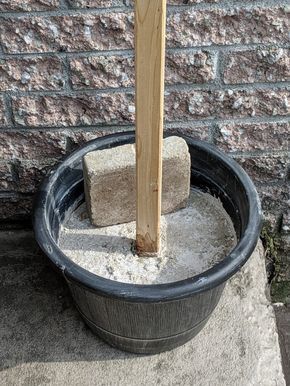 Light Pole Planter Diy, Planter Light Post Diy, Whiskey Barrel Light Poles, String Light Post Diy, Whiskey Barrel Planter With Lights, Planter Post Lights, String Light Poles, Light Posts, Backyard String Lights