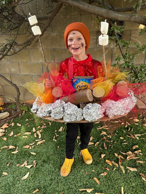 Campfire Halloween costume. Tulle (flames), pool noodles  (logs) foil (rocks) Campfire Parade Float, Dress Like A Camper Day At School, Campfire Halloween Costume, Smores Costume Families, Hiker Halloween Costume, Camper Costume Ideas, Campfire Costume Diy, S’mores Costume Diy, S'more Halloween Costume