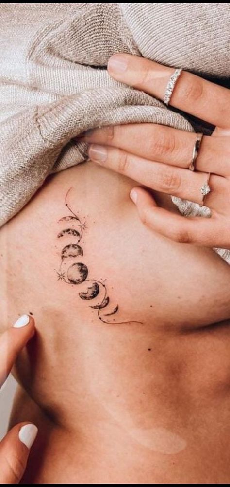 Discover the allure of Moon phase tattoos. We will explore the best designs and insights on choosing the ideal placement. Moon Phase Tattoo With Stars, Moon Phases Tattoo Designs For Women, Moon Tattoo Sternum, Lunar Tattoo, Moon Phase Tattoos, 50 Tattoo, Moon Phases Tattoo, Planet Tattoos, Underboob Tattoo