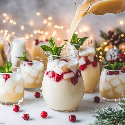 Looking for a fun and festive drink this holiday season? I've got just the thing! This White Christmas Punch Mocktail Recipe will light up your gatherings with its crisp taste and snowy appearance. It's non-alcoholic, so everyone White Christmas Drink Non Alcoholic, Christmas Mocktail Punch Bowl, Easy Christmas Punch Recipes Non Alcoholic, White Christmas Mocktail, Christmas Punch Mocktail, Winter Punch Non Alcoholic, White Punch Recipe, Holiday Non Alcoholic Punch, White Mocktails Non Alcoholic