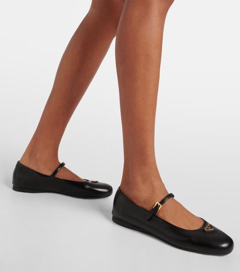 Logo leather Mary Jane flats in black - Prada | Mytheresa Luxury Mary Jane Flats With Ankle Strap, Luxury Women's Mary Jane Ballet Flats, Luxury Flat Mary Janes With Leather Sole, Luxury Flat Leather Mary Janes, Luxury Mary Jane Ballet Flats, Leather Mary Jane Flats, Alexander Mcqueen Clothing, Bridal Bag, Mary Jane Flats