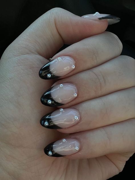 Black Arclyc Nails French Tip, Pearl Nails With Black Tips, Prom Acrylics Almond, Black Tips With Pearls, Black Nail Designs With Pearls, Black Almond French Tip With Gems, Almond Black French Tip Nails With Rhinestones, Black French Tip Pearl Nails, Black French Tip Nails Oval Shape