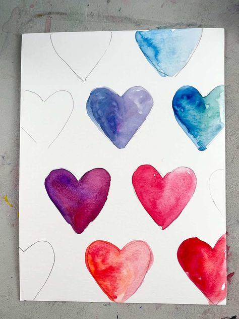 This easy Valentine's painting idea is a great for kids and adults. Learn how to use watercolor paint to make a fun rainbow heart painting. Watercolor Heart Painting For Kids, Q Tip Heart Painting, Watercolour Heart Painting, Watercolor Hearts Valentines Day, Watercolor Valentines Art, Valentine Drawings Art, Cute Valentines Paintings, Watercolor Valentine Cards Diy, Valentine’s Day Crafts For Adults