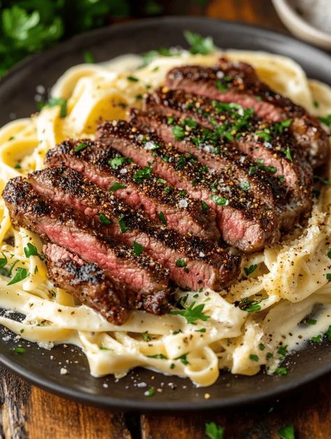 Prepare your taste buds for an unforgettable culinary experience with this Spicy Cajun Steak with Creamy Alfredo Pasta recipe! This dish combines the bold flavors of Cajun seasonings with the rich, creamy texture of Alfredo pasta. If you’re in the mood for something truly special, look no further. Whether you're cooking for a romantic dinner or a vibrant gathering, this meal promises to impress and delight. Spicy Cajun Steak Alfredo Pasta, What Goes With Steak Dinners, Flank Steak Pasta Recipes, Cajun Steak Pasta Recipes, Cajun Beef Pasta, Steak Tips Pasta Recipe, Steak Linguine Pasta, Creamy Pasta Aesthetic, Steak And Alfredo Pasta