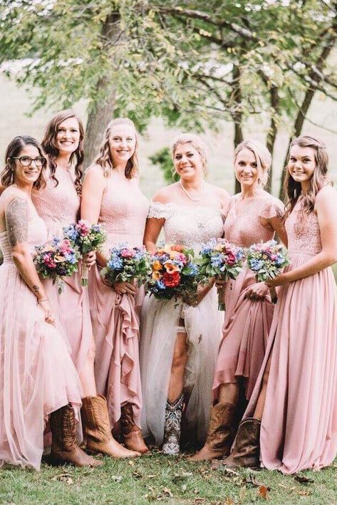 Cowboy boots and dusty rose bridesmaid dresses Bridesmaid Dresses With Cowgirl Boots, Bridal Party Cowboy Boots, Cowboy Boots Bridesmaids Long Dress, Long Bridesmaid Dresses With Boots, Bridesmaid Dresses Cowboy Boots, Cowboy Boot Bridesmaids, Dusty Pink Western Wedding, Cowboy Boots Bridesmaids, Bridesmaids With Boots