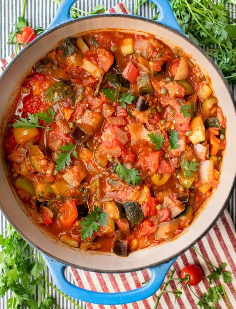 Ratatouille is a wonderful healthy vegetable stew with zucchini, eggplant and bell pepper simmered in garlicky tomato sauce and herbs; a delicious vegetarian side dish that's both comforting and low calorie. For those of us who want ratatouille in our regular dinner rotation, here's an easy no-fail ratatouille recipe that cooks in one pot and is absolutely delicious! Low Calorie Meals Vegetarian, Traditional Ratatouille, Easy Ratatouille Recipe, Easy Ratatouille, Easy Ratatouille Recipes, Vegetarian Side Dish, Ratatouille Recipe, Dinner Rotation, Healthy Vegetable