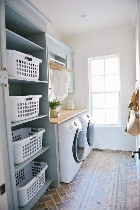 Laundry Room Storage Wall, First Floor Laundry Room, Laundry Room Separator Ideas, Closet And Laundry Room Ideas, Laundry Room Ideas With Sink In Middle, Laundry Room Basket Shelf, Towel Storage Laundry Room, Laundry Room With Folding Area, Laundry Room Towel Storage