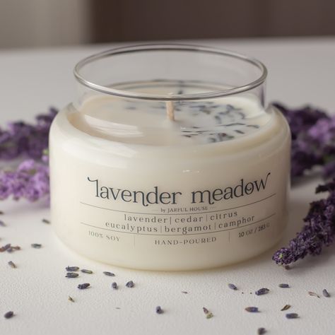 "Lavender Meadow Scented Soy Candle with dry lavender Imagine a summer meadow drenched in the morning sunlight, rows of lavender flowers gently shifting in a light breeze. Our Lavender fragrance oil stays true to this classic, beautiful flower, enhancing the natural aroma of lavender with notes of citrus, camphor, and eucalyptus. Top: Bergamot, Citrus Middle: Lavender Base: Cedar, Powder, Eucalyptus, Camphor CANDLE INFO: * Jar Size: 10 oz. |3\"x4\" * Wax: 100% Soy Wax | Made in the USA * Premium Lavender Meadow, Dry Lavender, Calming Candles, Morning Sunlight, Lavender Aromatherapy, Summer Meadow, Lavender Fragrance, Aromatherapy Gifts, Lavender Candle