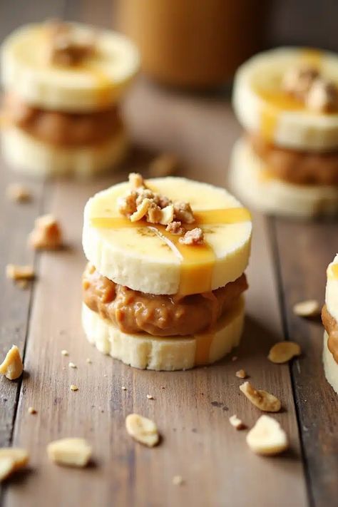 Sliced bananas stacked with peanut butter, topped with chopped nuts on a wooden table. Whole30 Thanksgiving, Lemon Coconut Bars, Whole 30 Dessert, Chocolate Creations, Baked Pears, Sweet Potato Brownies, Berry Compote, Coconut Bars, No Flour Cookies