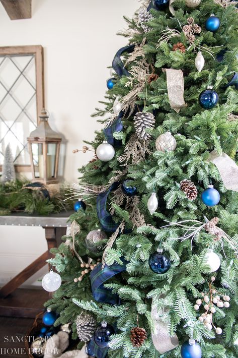 Cozy plaid Christmas decor in green and blue adds a warm and casual look to our family room for the holiday season. With the addition of chunky knit accents and warm leather, our family is ready to snuggle in for our favorite season. Blue Tartan Christmas Tree, Modern Blue Christmas Decor, Navy And White Christmas Decor, Blueberry Christmas Tree, Christmas Tree Inspiration Blue, Green And Blue Christmas Decor, Navy And Green Christmas Decor, Christmas Tree Blue Decorations, Blue Green Christmas Decor