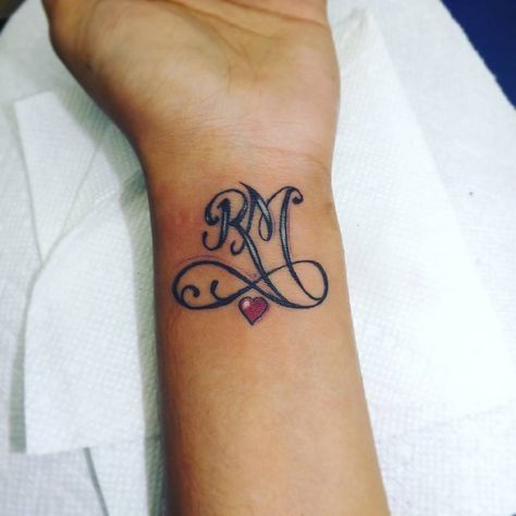 If matching couples' tattoos are a bit too much for you, scale it back with a simple letter of your partner's first name. Getting their initials inked is a S Name Tattoo Designs, S Name Tattoo, Initial Tattoos, Couple Tattoos Unique Meaningful, Diy Tattoo Permanent, Best Couple Tattoos, M Tattoos, Couple Tattoos Unique, Tattoos Unique