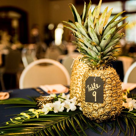 reception table decor, gold pineapple centerpieces, palm fronds, gold navy and green wedding colors, cielo at castle pines reception, colorado wedding inspiration, mountain wedding planner Gold Pineapple Centerpiece, Wedding Table Planner, Pineapple Centerpiece, Pineapple Wedding, Rustic Wedding Decorations, Luau Wedding, Fiesta Tropical, Green Wedding Colors, Gold Pineapple