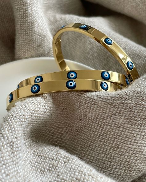 Evil Eye Bangle… 🧿✨ Did you know the belief behind the evil eye symbol dates back almost 3,000 years to ancient Greek & Rome!? It is now mainly linked to Middle Eastern & Turkish culture & is used to ward off variations of evil intentions… It is believed to be one of the strongest symbolic images in the world. Wearing an evil eye as an amulet (good luck charm!) is believed to provide you with protection against evil forces. For example… When someone gives off jealousy vibes, they can cu... Evil Eye Bangle, Evil Eye Symbol, Eye Symbol, Turkish Culture, Luck Charm, Luck Charms, Gemstone Jewellery, Ancient Greek, Middle Eastern