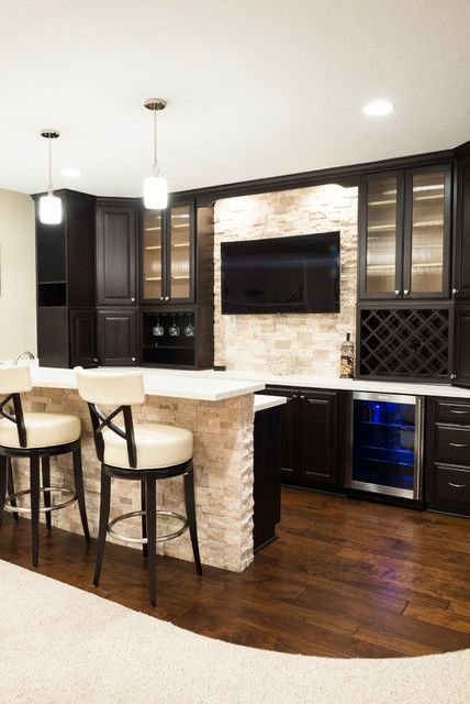 Basement Bar with Wood Flooring and Stone Wall contemporary-home-bar Finished Basement Bars, Basement Bars, Basement Bar Plans, House Basement, Appliance Garage, Basement Bar Designs, Basement Inspiration, Basement Kitchen, Herringbone Backsplash