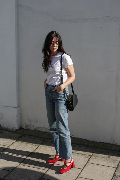 French-inspired outfit featuring plain white t-shirt, blue jeans, red heels and APC demi-lune bag. White Shirt And Blue Jeans, Plain White T Shirt, Red Heels, French Inspired, Plain White, White T Shirt, White Tshirt, White Shirt, Sustainable Fashion