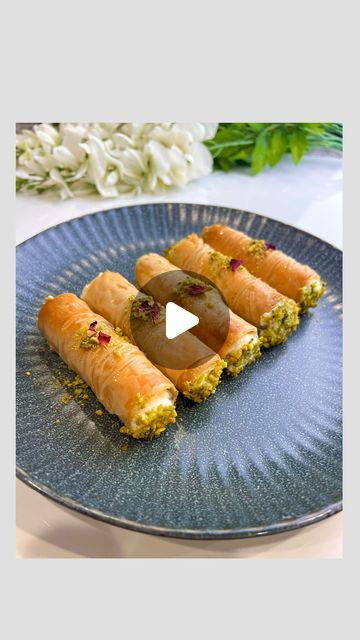 𝓜𝓪𝓻𝓲𝓪𝓶 on Instagram: "Those baklava rolls filled with Arabic ashta are the perfect, easy, delicious, and light dessert for Ramadan. They are so easy to make and so delicious. You can prepare the baklava rolls ahead of time and fill them the day you want to serve them. Place them in the fridge after filling them, and they will stay crispy for up to 2 days.  Ingredients: - 1 pack of phyllo sheets - Ghee or butter, as needed - Arabic ashta (recipe posted a couple of posts before this one) - Simple syrup - Crushed pistachios  Simple Syrup: - 2 cups sugar - 1 cup water - 2 tsp lemon juice - 1 tsp rose water - 1 tsp orange blossom water  Combine sugar and water in a pot, and without stirring, heat the mixture until it starts bubbling. Once bubbling, add lemon juice, rose water, and orange Baklava Rolls, Arabic Dessert Recipes, Baklava Dessert, Arabic Sweets Recipes, Ramadan Desserts, Arabic Desserts, Phyllo Recipes, Lebanese Desserts, Arabic Dessert