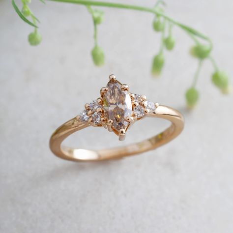 Our Marquise Champagne Diamond Zira ring is handcrafted with 14kt yellow gold and showcases a stunning marquise champagne diamond and framed with Canadian diamonds✨ #eradesignjewellery #uniqueengagementring #womenownedbusiness #womanowned #ringinspiration #weddingjewellery #engagementringideas #engagementringinspiration #shopvancouver #vancouverbridal Laurie Fleming, Engagement Ring Inspiration, Champagne Diamond, Unique Engagement Rings, Wedding Jewelry, Dream Wedding, Champagne, Wedding Rings, Diamonds