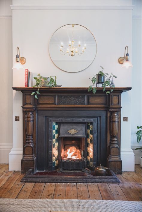 Original dark wood fire surround, period tiles, farrow and ball paint, servant bells, sanded wooden floors Edwardian House Interior, Edwardian Houses, Edwardian Living Room, Edwardian Interiors, Edwardian Terrace, Victorian Fireplace Tiles, Edwardian Fireplace, Bigger House, Fireplace Tiles