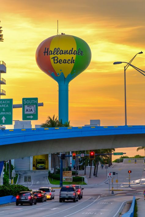 Experience the allure of Hallandale Beach, Florida, through this captivating image taken during sunrise. The Hallandale Beach Water Tower stands tall and proud as the sun’s rays paint the sky with an explosion of vibrant yellow hues. Hallandale Beach Florida, Manifesting 2024, Tower Stand, Florida Photography, Yellow Hues, Beach Water, Water Tower, Florida Beaches, Beach Florida