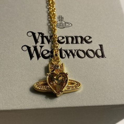 Vivienne Westwood heart necklace in gold Vivienne Westwood Gold Jewellery, Vivienne Westwood Gold Necklace, Vivienne Westwood Necklace Aesthetic, Gold Vivienne Westwood Necklace, Vivienne Westwood Heart Necklace, Vivienne Westwood Necklace Gold, Vivienne Westwood Belt, Gold Vivienne Westwood, Westwood Jewellery