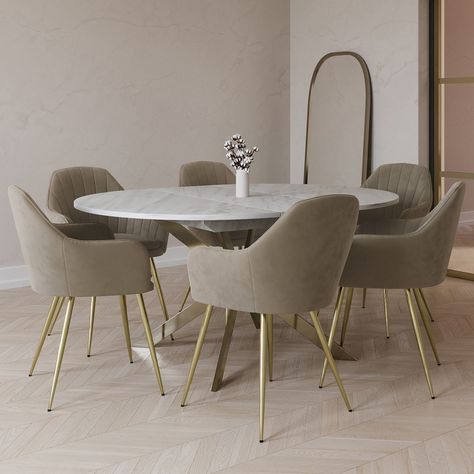 . This bundle includes  . 1 x Round to Oval Marble Effect Extendable Dining Table in White – Reine  . 6 x Mink Matt Velvet Dining Chairs – Logan . All about meTransform your dining space with this modern dining set perfect for hosting. The table easily extends with the simple butterfly mechanism and the textured marble effect top is scratch-proof heat-resistant and easy to wipe clean. The Logan dining chairs are finished in mink matt velvet with brushed brass legs the two-tone design Dining Table Marble Top Modern, Cream Marble Table Dining, White Marble Kitchen Table, Oval Dining Table Marble, Dining Table And Chairs Ideas, Marble Table Dining, Oval Extendable Dining Table, Chairs With Gold Legs, Dinner Table Chairs