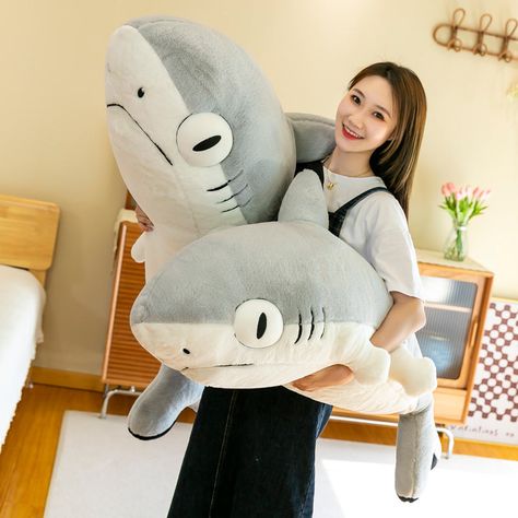 Our adorable Funky Shark Plush Toy is the perfect addition to any stuffed animal collection! This cute and cuddly plushie is made of soft, high-quality materials and is sure to bring a smile to the face of anyone who cuddles it.This fun and playful animal is available in four sizes, so you can choose the one that's perfect for you. Whether you're looking for a small companion for your desk or a large snuggle buddy for your bed, we've got you covered.Not only is the Funky Shark Plush Toy cute and Stuffed Shark, Shark Doll, Shark Cat, Comic Wallpaper, Shark Plush, Doll Cute, Cute Shark, Kawaii Plush, Samoa