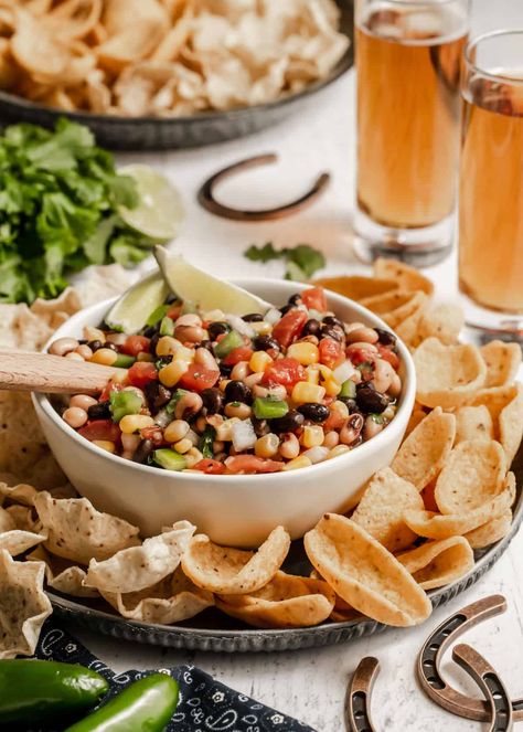 Easy cowboy salsa feeds a crowd and combines canned beans & corn with fresh vegetables & Italian dressing for a party dip everyone loves. Football Party Food Ideas, Cowboy Salsa, Game Day Dip, Football Party Snacks, Party Food Easy Appetizers, Dip Ideas, Roasted Red Pepper Dip, Corn Dip Recipes, Baked Artichoke