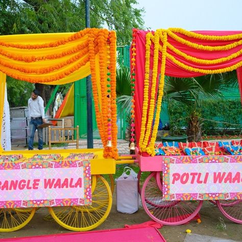 Indian Wedding Giveaways, Carnival Wedding Theme, Haldi Decoration Ideas, Stall Decorations, Sangeet Decor, Mehendi Decor Ideas, Wedding Games For Guests, Indian Wedding Decor, Wedding Entrance Decor