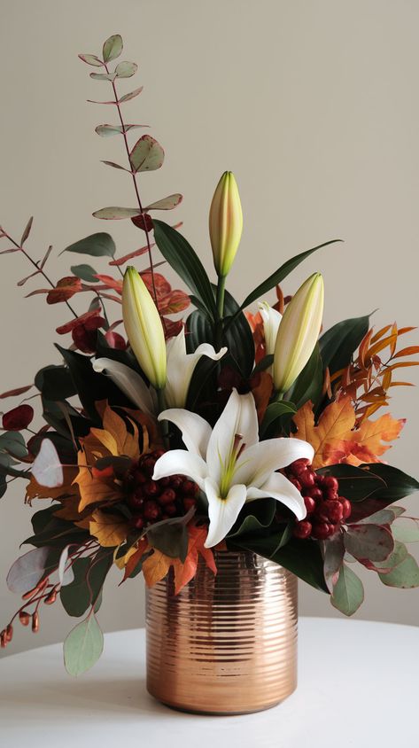 Add a modern twist to your decor with these fall floral arrangements. Sleek, stylish, and perfect for a contemporary fall aesthetic. #ModernFallFloralArrangements #FallFlowerArrangements #FallFlowersAesthetic Thanksgiving Floral Arrangements, Fall Floral Centerpieces, Tall Floral Arrangements, Ideas For Autumn, Contemporary Flower Arrangements, Modern Floral Arrangements, Thanksgiving Floral, Fall Flower Arrangements, Elegant Bouquet