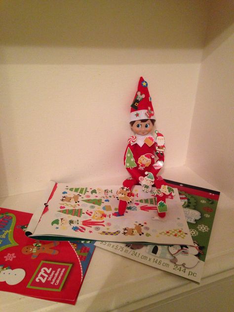 Elf on the Shelf - Got into Holiday Stickers. :) Elf On The Shelf Ideas Aluminum Foil, Elf On The Shelf Stickers, Elf Stickers, Elf 2023, Elf Ideas Easy, Shelf Cover, Elf Ideas, Holiday Stickers, Shelf Ideas