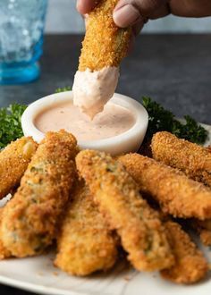 Fried pickle spears are crispy, tangy, and served with a homemade dipping sauce. Make this recipe for a delicious appetizer or party snack! Pluckers Fried Pickles Recipe, Fried Pickle Spears, Burpless Cucumber, Restaurant Pics, Pickle Spears, Fried Dill Pickles, Deep Fried Pickles, Football Foods, Fried Pickles Recipe