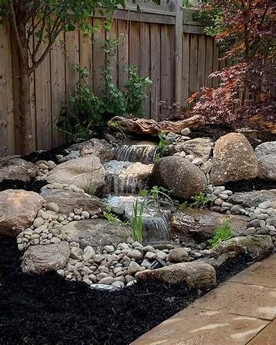 Ponds - Pondless Waterfalls - Waterscape Designs & Installation ... Water Falls Backyard, Water Fall Garden, Rock Waterfall Landscaping, Backyard Water Feature Ideas, Front Yard Water Feature, Waterfall Backyard, Backyard Pondless Waterfall, Rock Water Feature, Backyard Waterfalls