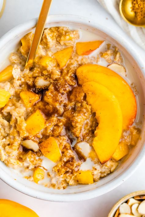 This peaches and cream oatmeal uses real peaches, coconut sugar and oat milk for the creamiest bowl of oatmeal that tastes like those instant packets you used to eat at a kid! Overnight Peach Oatmeal, Peaches And Cream Oatmeal, Instant Oatmeal Packets, Peach Oatmeal, Bowl Of Oatmeal, Oat Bowls, 2b Mindset, Oatmeal Packets, Oatmeal Bowls