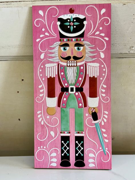 Glitter Pink Nutcracker Sign – TMIGifts Nutcracker Sign Diy, Wooden Nutcracker Door Hanger, Nutcracker Canvas Painting, Painted Nutcracker On Wood, Easy Nutcracker Painting, Nutcracker Window Painting, Painted Nutcracker Ideas, Nutcracker Decorations Ideas, Nutcracker Painting Ideas