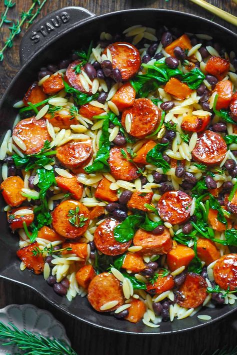 Butternut Squash and Black Bean Orzo with Sausage and Spinach in a cast iron skillet. Orzo With Sausage, Butternut Squash And Sausage, Sausage Orzo, Roasted Butternut Squash Cubes, Butternut Squash Black Bean, Simple Spinach Salad, Sausage And Spinach, Sausage Dinner, Autumn Dinner