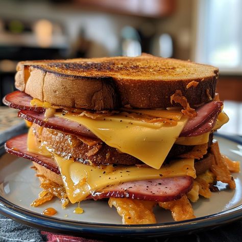 🍔 Dive into the nostalgia with a crispy Fried Bologna Sandwich! 🌟 🍽️ Fried Bologna Sandwich 🛒 Ingredients: Bologna slices: 4 White bread: 2 slices American cheese: 2 slices Mustard: To taste Butter: For frying 👩‍🍳 Instructions: Fry: In a skillet, fry bologna slices until crispy. Assemble: On buttered bread, layer fried bologna, cheese, and mustard. Grill: Fry sandwich until golden. 🌟 Classic comfort food! Perfect for a quick lunch! #FriedBolognaSandwich American Cheese Recipes, Fried Bologna Sandwich, Buttered Bread, Fried Bologna, Bologna Sandwich, Twisted Recipes, Sandwich Ingredients, Sandwich Shops, Quick Lunch