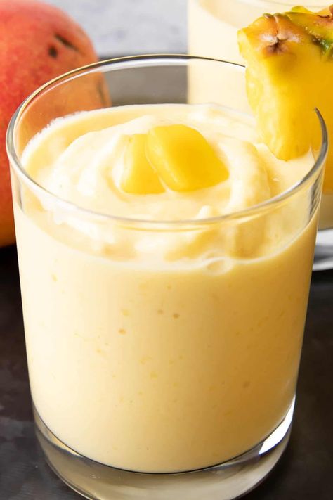 Mango Pineapple Smoothie from Beaming Baker. Brightly refreshing Mango Pineapple Smoothie bursting with tartly sweet pineapples, juicy mangoes, and simple ingredients! The easiest pineapple mango smoothie recipe! Best Mango Smoothie, Pineapple Mango Smoothie, Beaming Baker, Mango Smoothie Recipe, Mango Pineapple Smoothie, Mango Smoothie Recipes, Pumpkin Smoothie, Mango Pineapple, Coconut Smoothie