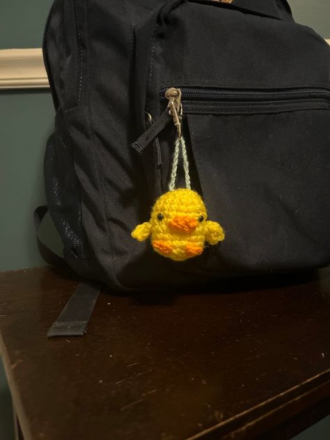 This cute handmade crochet duck keychain is the perfect addition to any bag! It would make the perfect gift for a loved one or for yourself! This keychain features a metal swivel snap to easily clip onto any bag, keys, or other item.  It's handcrafted out of yarn, Poly-fil, safety eyes, and a metal clasp.  The dimensions are 5in. long and 2in. wide.  If any color customizations are wanted, message me and we can most likely work something out :) Crochet Keychain Charms, Crochet Duck Keychain, Bag Charm Crochet, Crochet Bag Charm, Duck Backpack, Duck Keychain, Charm Crochet, Crochet Duck, Duck Bag