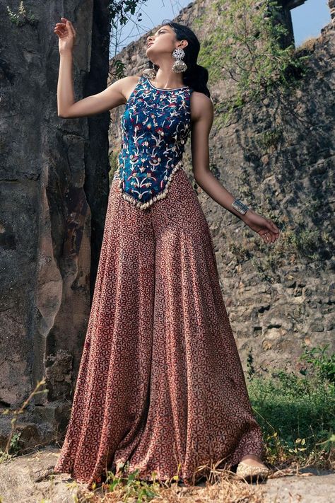 Buy #peach flared #palazzo with indigo blue & pink printed motifs by #NitaraDhanraj at #AzaFashions Shop online now at #Azafashions.com Call +91 8291990059 or email contactus@azafashions.com for enquiries. #wedding #festive #ethnic #tradional #shopping #shoponline #party #reception #bride Printed Skirt Top Indian Outfit, Skirt Top Indian Outfit, Palazzo And Top, Cape Skirt, Flared Palazzo, Navratri Dress, Trendy Outfits Indian, Anamika Khanna, Traditional Indian Dress