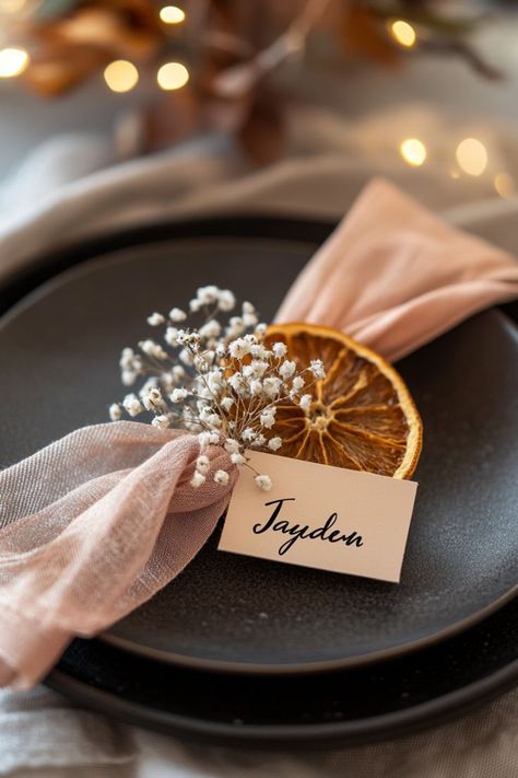 DIY details can make a Friendsgiving tablescape so personal! Try tying dried flowers around slices of orange for napkin rings—it’s budget-friendly and charming. Wouldn’t these little touches make your Thanksgiving table feel extra special? Friendsgiving Table Decor, Friendsgiving Tablescape, Napkin Ring Ideas, Orange Napkins, Friendsgiving Table, Green Tablescape, Woven Charger, Modern Tablescape, Glass Vases Centerpieces