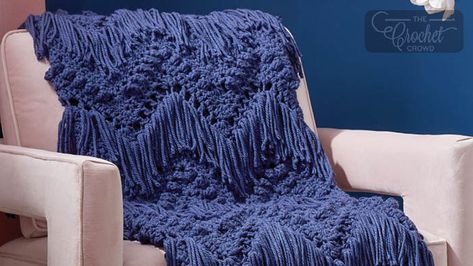 Crochet Bobbles and Fringe Blanket Pattern | The Crochet Crowd Seed Stitch Blanket, Bernat Softee Chunky Yarn, Bernat Softee Chunky, Fringe Blanket, Easy Knitting Patterns Free, Crochet Crowd, Crochet Blanket Pattern Easy, Popular Crochet, Popcorn Stitch