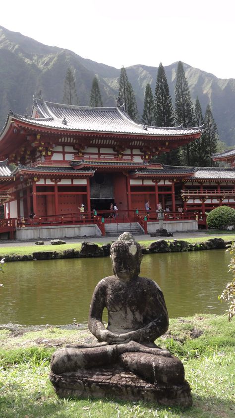 The Byodo-In Temple is a grand replica of an ancient Japanese Buddhist temple and is located in nearby Kaneohe, within easy reach of central Honolulu. A huge wooden statue of the Buddha is the main sight in this temple, a replica of the original 11th-century structure in Japan. The temple itself is located within the Valley of the Temples cemetery, which also houses a meditation house and beautiful gardens, complete with a large carp-filled pond. Honolulu, HAWAII Japanese Buddhist Temple, Buddhist Temple Aesthetic, Old Japanese Temple, Japanese House Aesthetic, Place Reference, Meditation House, Tmnt Au, Japanese Buddha, Valley Of The Temples