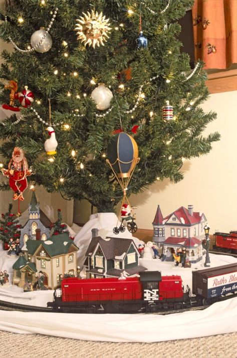 Choosing a train for the Christmas tree | News, Sports, Jobs - Lawrence Journal-World: news, information, headlines and events in Lawrence, Kansas Christmas Tree With Train And Village, Train Under Christmas Tree, Train Around Christmas Tree, Christmas Tree Train Set, Christmas Tree Train, Christmas Tree Village, Christmas Village Sets, Christmas Layouts, Black Christmas Trees