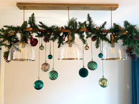 Made from drift wood, a cheap garland & some baubles. Hanging Bauble Decoration Ideas, Bauble Garland, Bar Light Fixtures, Hanging Baubles, Xmas Garland, Xmas Window, Christmas Dining Table Decor, Christmas Decs, Dining Table Decoration