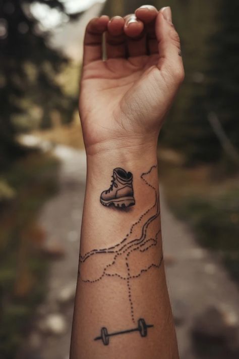 Hiking boot tattoo on forearm with mountain trail design. Hiking Boot Tattoo, Outdoors Tattoos For Women, Wrist Tattoo Designs For Women, Unique Wrist Tattoos, Wrist Tattoo Designs, Wrist Tattoo Ideas, Forest Silhouette, Exploring Nature, Tattoo Ideas For Women