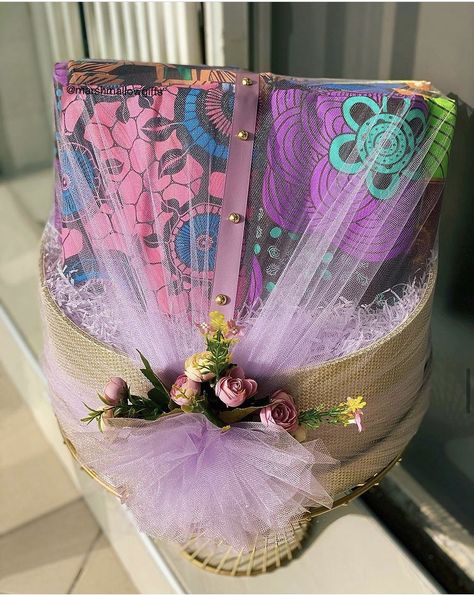 Bride’s cloths wrapped in lilac in gold boxes for engagement dowry wrapping. Flowers For Engagement, Engagement Clothes, Traditional African Wedding, Lilac Theme, Engagement Gift Baskets, Traditional Wedding Gifts, Wedding Gift Wrapping, Wrapping Gifts, Gold Theme